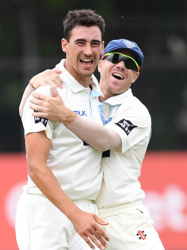 David Warner congratulates NSW teammate Mitchell Starc on another wicket this week. Picture: AAP Image/David Moir