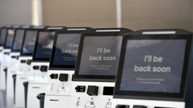 Unused check-in kiosks are seen at the Virgin Australia terminal at Sydney’s domestic airport. Picture: AAP