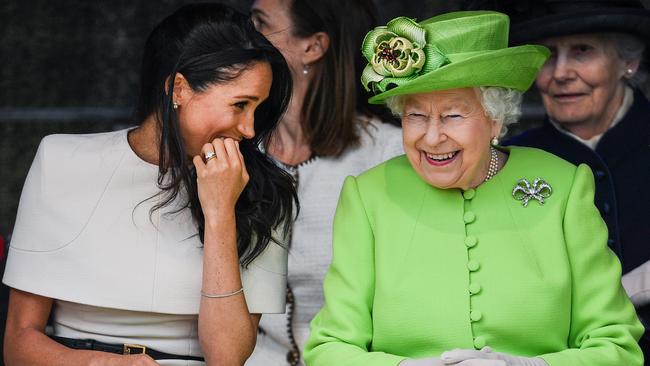 Meghan Markle laughs with Queen Elizabeth II just weeks after marrying Prince Harry. Picture: Getty Images