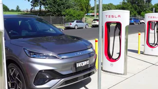 Sydney’s ‘Tesla Tom’ posted a picture of a Tesla Supercharger in Bathurst powering up a BYD Atto 3 electric car on his channel Ludicrous Feed last year. Tesla has opened up several of its locations in Australia to charge all EV brands. Picture: YouTube