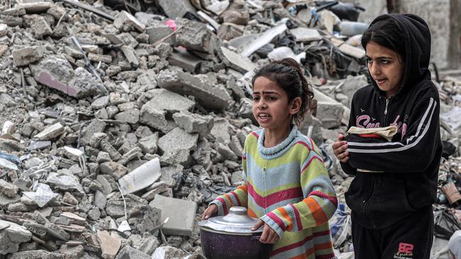 Kids search desperately for food to eat in Gaza. Picture: AFP