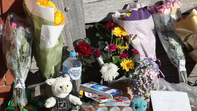 Tributes left at the scene for the family. Picture: David Crosling