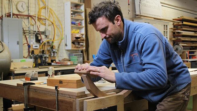 Rohan Ward at work in his workshop.