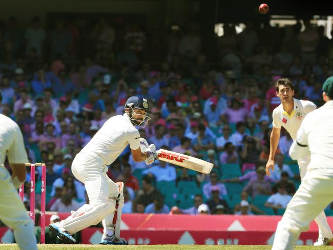 Virat Kohli sends a ball towards Steve Smith who dropped the catch. Pic Mark Evans