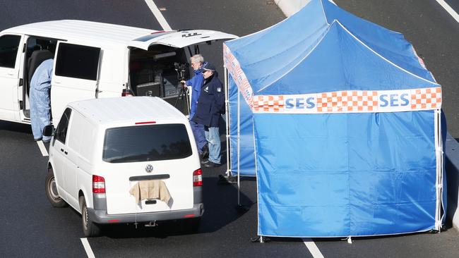 Police and emergency services on the Eastern freeway investigate a white van which is possibly involved in a shooting. Saturday, November 9, 2019. Picture: David Crosling Eastlink shooting victim Paul Virgona