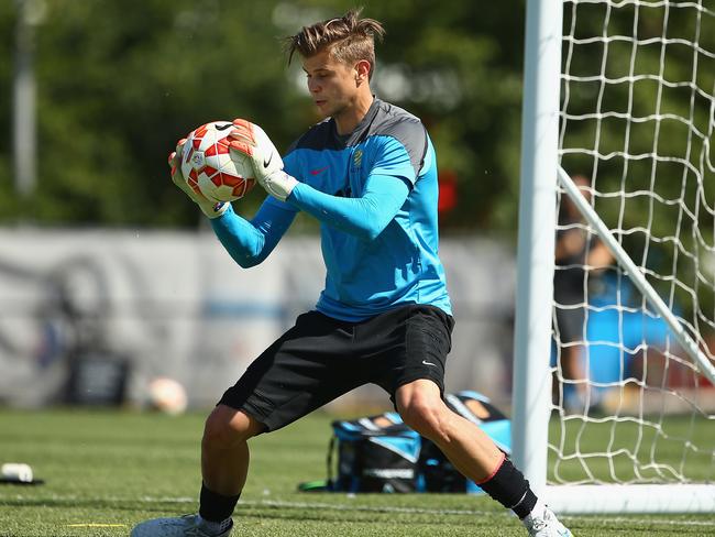 Goalkeeper Mitchell Langerak gets some work in.