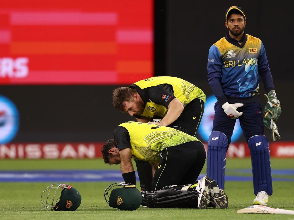 Aaron Finch checks on Glenn Maxwell. Picture: Paul Kane/Getty