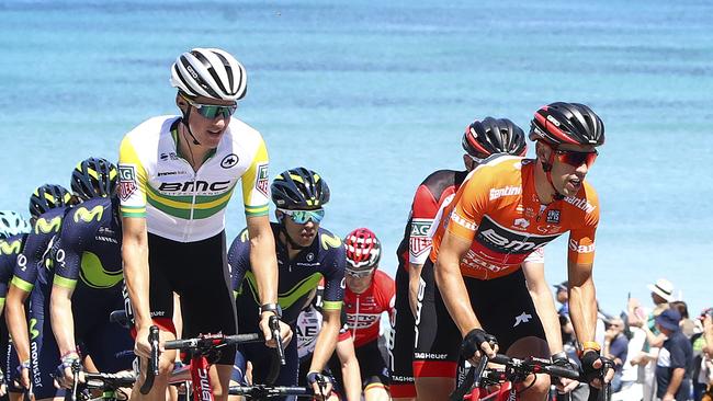 Miles Scotson helps team mate and eventual winner Richie Porte on the trip to Willunga Hill at last year’s Tour Down Under. Picture: Sarah Reed