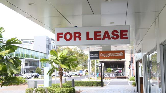 One of the many for lease signs hanging in vacant retail shops formally occupied by travel agents on Shields St. Picture: Peter Carruthers