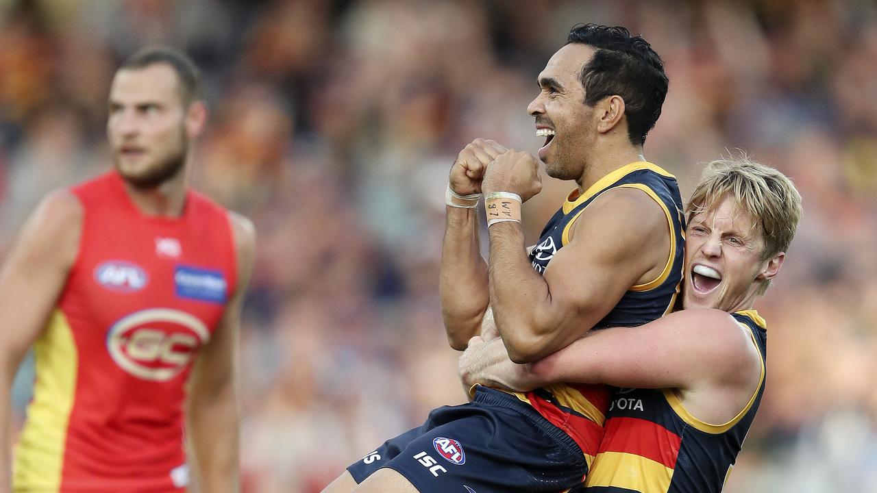 Eddie Betts scores and celebrates his first goal in his 300th game — with co-captain Rory Sloane. Picture Sarah Reed