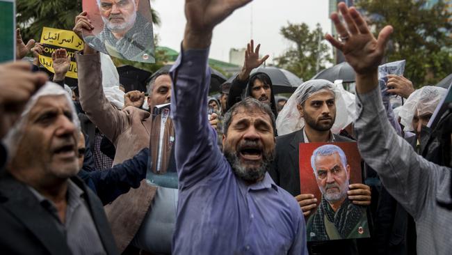 TEHRAN, IRAN - SEPTEMBER 28: Iranians protest with anti-Israeli and anti-American slogans while participating in a protest rally to condemn the Israeli airstrike in Lebanon that killed Hassan Nasrallah and several Hezbollah commanders in Tehran, Iran,on September 28, 2024 in Tehran, Iran. Israel announced earlier that it had killed Hassan Nasrallah, leader of the Iran-backed Lebanese militant and political group Hezbollah, in overnight strikes on southern Beirut. (Photo by Majid Saeedi/Getty Images)