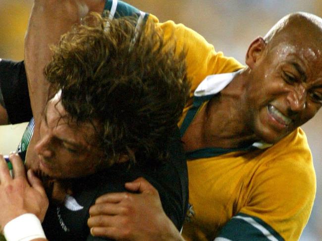 15/11/2003. George Gregan takes on Bryon Kelleher. Semi-Final, Australia v New Zealand at Telstra Stadium. Rugby Union World Cup.