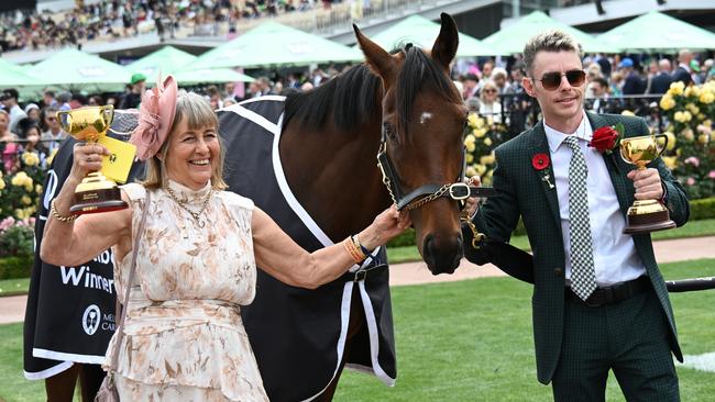 Melbourne Cup-winning Co trainer Sheila Laxon poses with Knight’s Choice and connections after the historic win. Picture: Getty Images