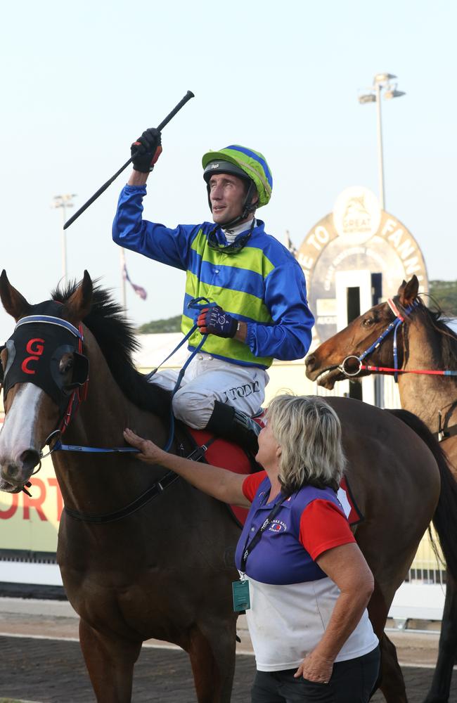 Victory as Gary Clarke trained horse Playoffs ridden by Jarrod Todd scores an emotional win in the Great Northern Darwin Cup. Picture: Glenn Campbell