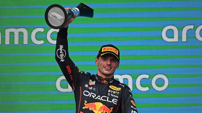 Red Bull Racing's Dutch driver Max Verstappen celebrates on the podium after winning the Formula One United States Grand Prix, at the Circuit of the Americas in Austin, Texas, on October 23, 2022. (Photo by Patrick T. FALLON / AFP)