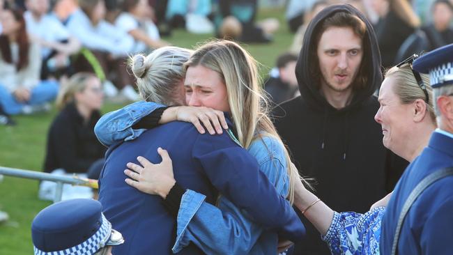 Amy Scott embraces a member of the public. Picture: Getty Images