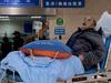 An elderly covid-19 coronavirus patient lies on a stretcher at the emergency ward of the First Affiliated Hospital of Chongqing Medical University in China's southwestern city of Chongqing on December 22, 2022. (Photo by Noel Celis / AFP)