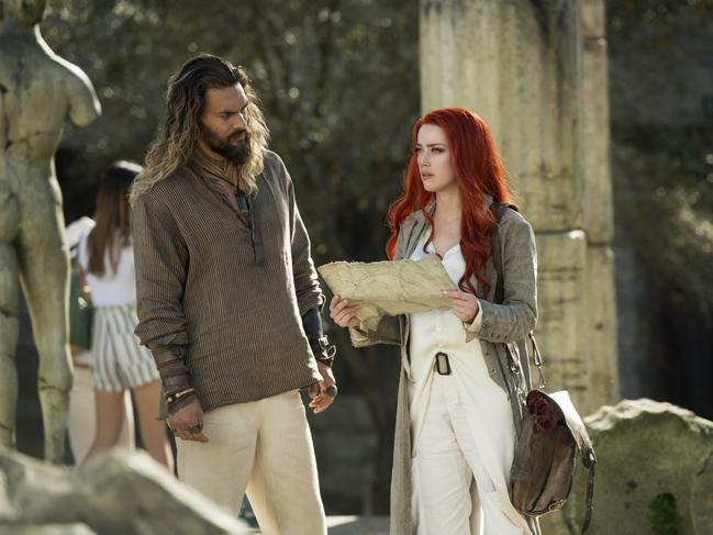 Arthur Curry (played by Jason Momoa) and Mera (Amber Heard) attempt to solve a riddle during a surface world quest.