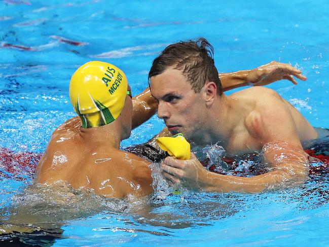 Australia's Kyle Chalmers celebrates winning the gold medal in the Men's 100m Freestyle Final with Australia's Cameron McEvoy on day five of the swimming at the Rio 2016 Olympic Games. Picture. Brett Costello