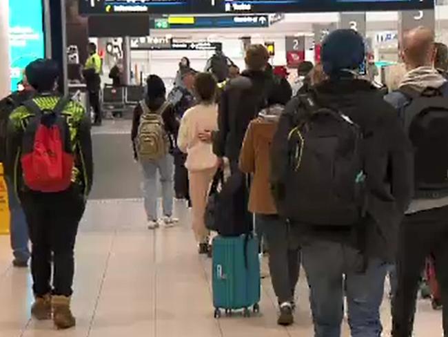 Passengers are seen at Sydney Domestic Airport after disembarking Jetstar flight  flight JQ520 from Melbourne which arrived in Sydney on Tuesday night, July 7, 2020. None of the passengers were screened by medical officers upon their arrival., , Picture: Nine News