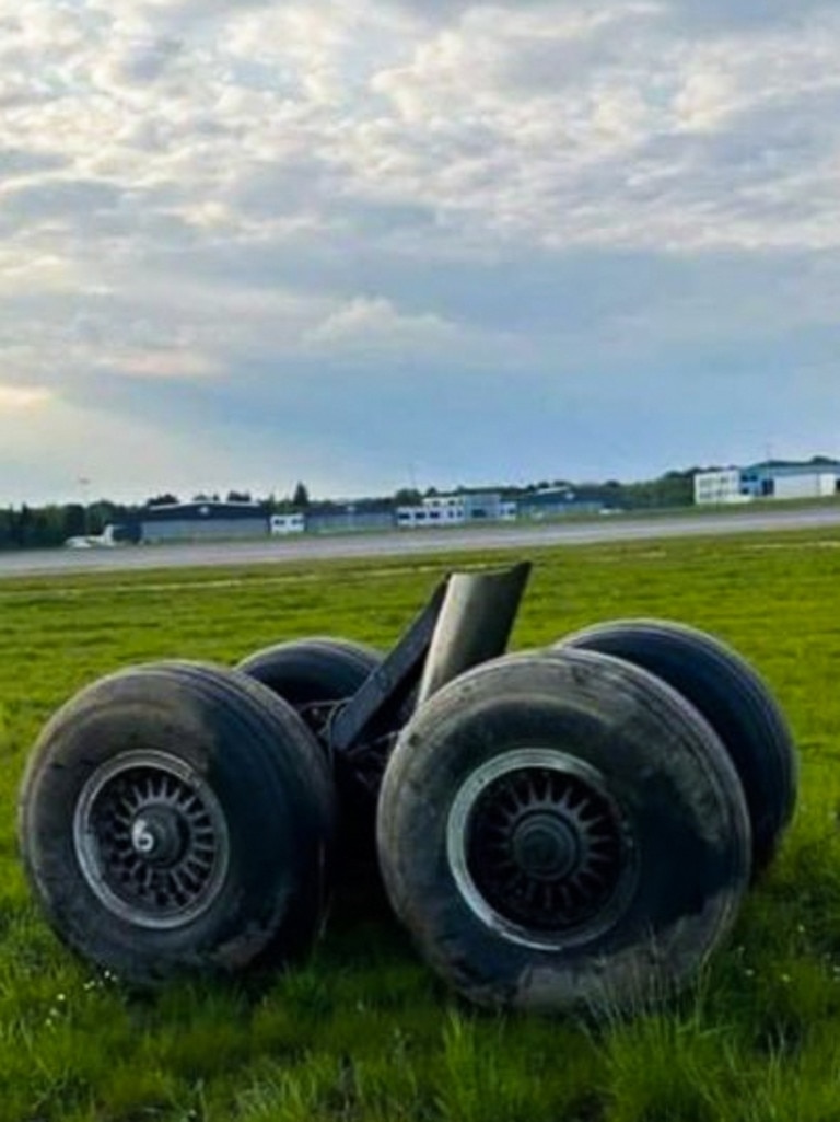 Its four wheels seen on the grass adjacent to the runway. Picture: Viralpress/Australscope