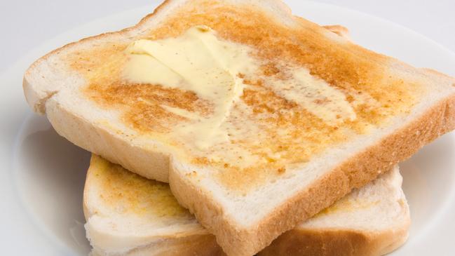 A piece of white toast with butter is a common breakfast staple. Picture: iStock