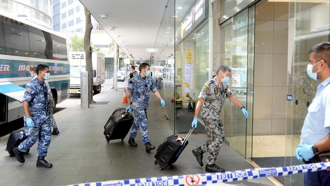 Defence personnel arrive at the Sofitel hotel in Sydney. Picture: Jeremy Piper