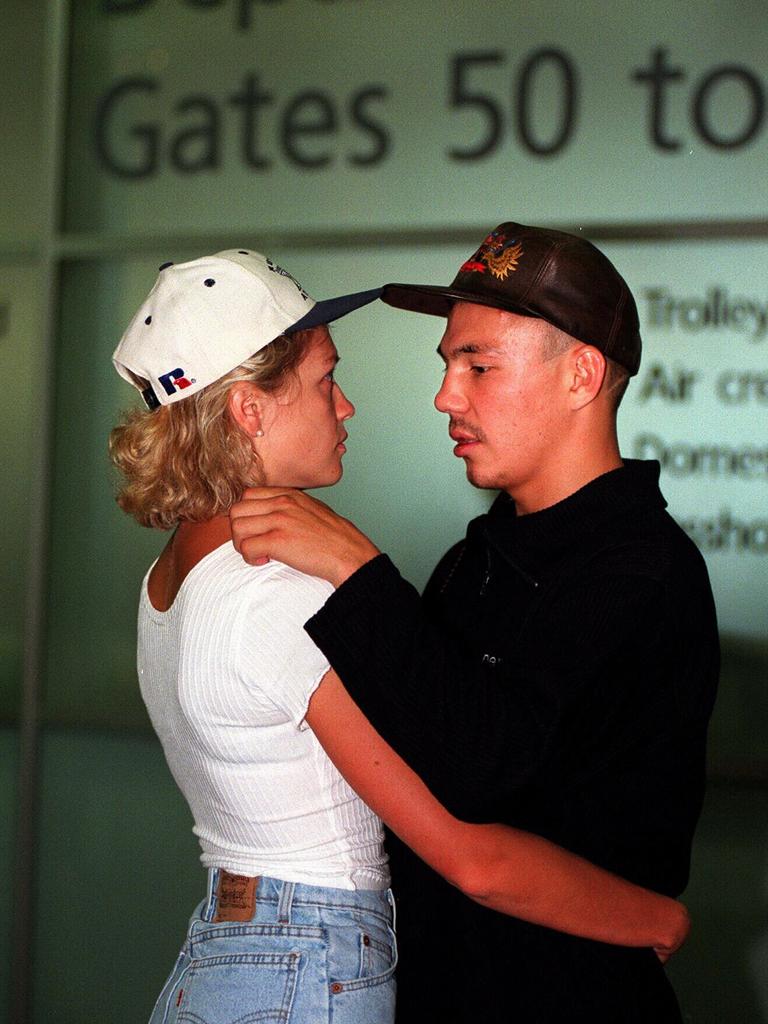 Kostya Tszyu says goodbye to wife Natalia at Sydney Airport before heading off for a title defence in the US.