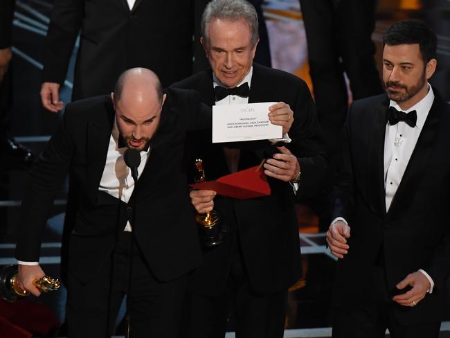 La La Land producer Jordan Horowitz, actor Warren Beatty and host Jimmy Kimmel tried to fix up the bungle. Picture: AFP/Mark Ralston