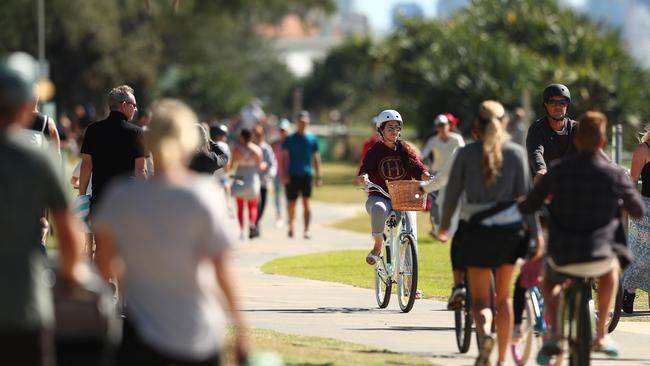 People ride bikes along Miami foreshore after the easing of lockdown measures. Picture: Getty.