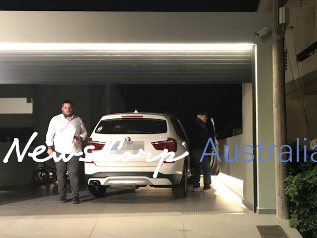 John Macris’ father (right) arrives at John Macris’ house. Picture: Angelos Christofilopoulos