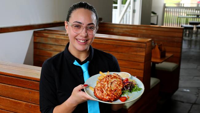 Runcorn Tavern voted Best parmigiana in Brisbane by our readers and pictured is waitress Kaiana Tuala. Picture: AAP/ David Clark