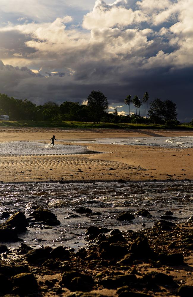 Dhunumbu Munuggurr, frolicks on the beach to burn off nervous energy before dancing to celebrate people from all walks of life coming together with Yirrkala's indigenous people. Picture: Michael Franchi