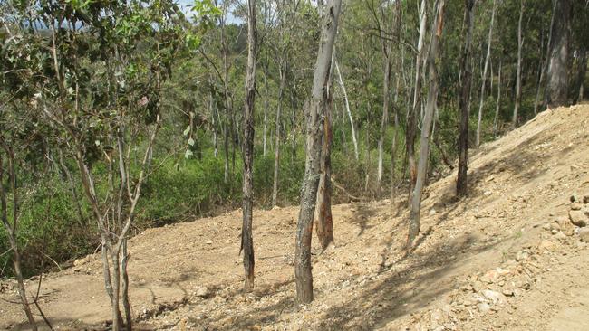 Property owners need to be aware that contaminated fill can be hard to pick. This deposited material may look clean from afar, but an EPA investigation revealed it was contaminated with waste, including asbestos waste. Picture: NSW EPA