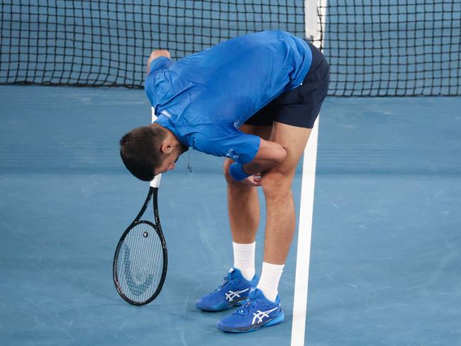 Djokovic reacts from an injury while playing against Carlos Alcaraz during their quarterfinal match. Picture: DAVID GRAY / AFP