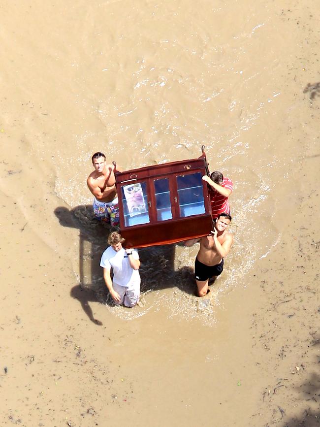 Desperation as residents fled with furniture along Oxley Road at Graceville.