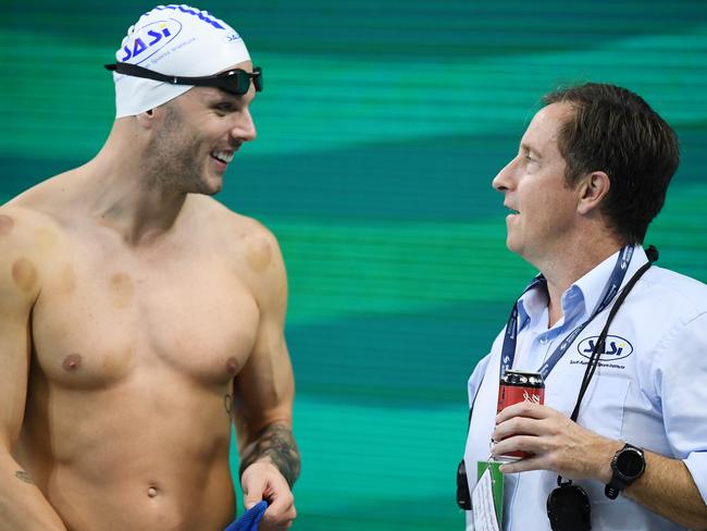 ADELAIDE, AUSTRALIA - JUNE 17: Kyle Chalmers chats to SASI coach Peter Bishop during the warm-up session of the Australian National Olympic Swimming Trials at SA Aquatic & Leisure Centre on June 17, 2021 in Adelaide, Australia. (Photo by Mark Brake/Getty Images)