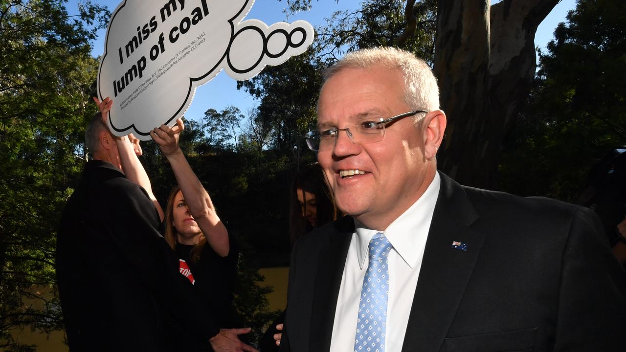 Prime Minister Scott Morrison with anti-Adani protesters on a walk at Studley Park in Kew, Melbourne. Picture: AAP