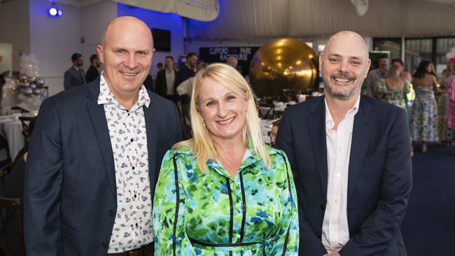 At the Emergency Services race day are (from left) Michael Thiesfield, Kirsty Thiesfield and Grant Spooner at Clifford Park, Saturday, August 10, 2024. Picture: Kevin Farmer