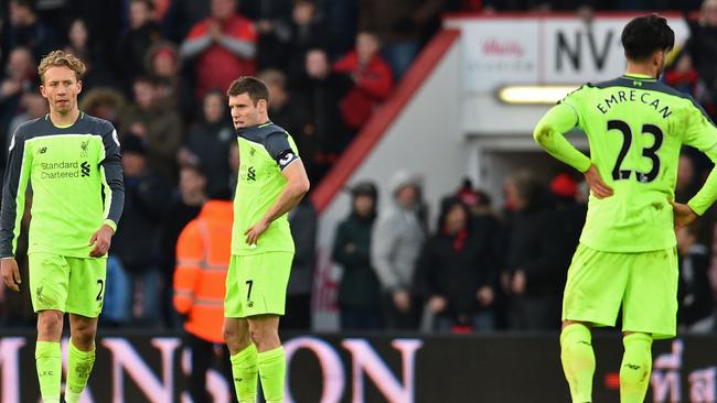 Lucas Leiva (L), James Milner and Liverpool's German midfielder Emre Can (R).