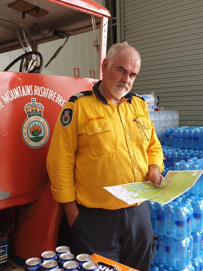 Blaxland RFS Captain, Stuart Carmichael, is pictured beside a 1943 RAAF radio vehicle purchased by Blue Mountains Council in 1958 for the then Blaxland Bushfire Brigade’s use, currently being restored for community engagement purposes. Picture: Isabell Petrinic