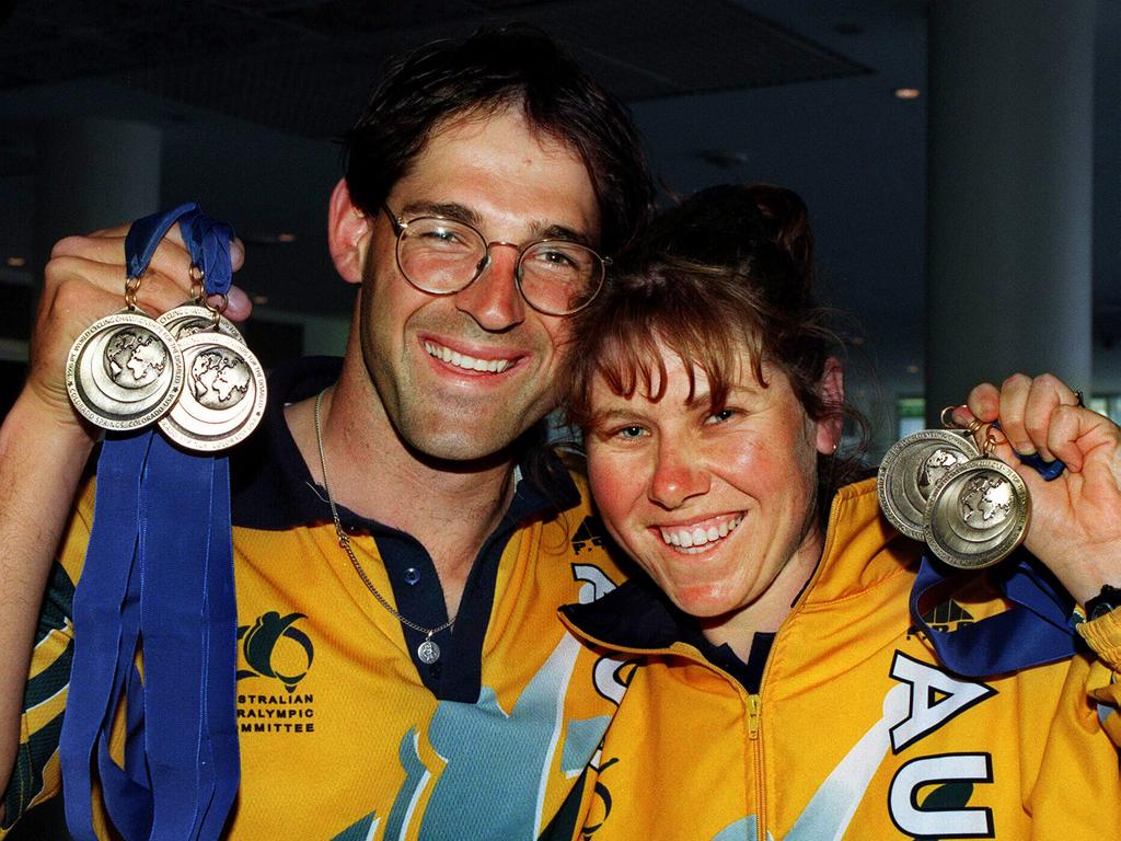 Kieran and Kerry Modra with their gold medals from the 1998 Paralympic World Cycling Championships.