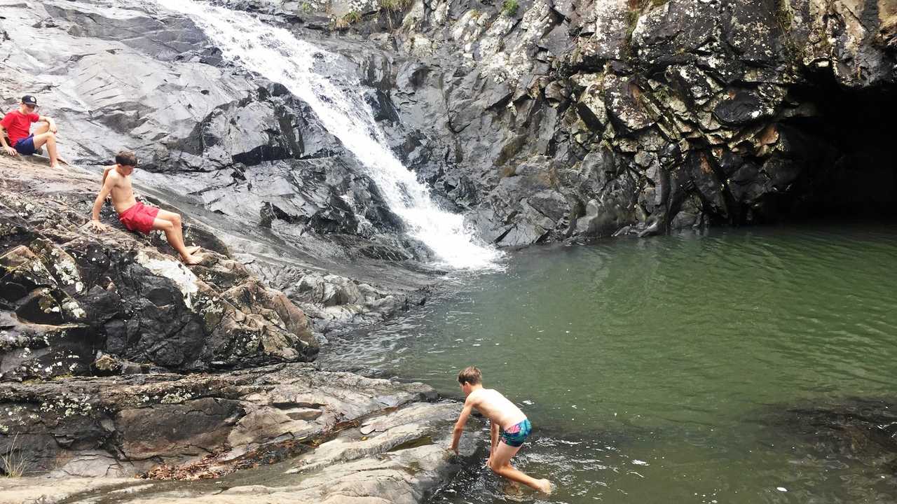 Kate Bennie's three sons had do qualms with jumping into a waterfall in the middle of winter. Picture: Kate Bennie