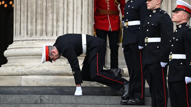 A member of the military stumbles while on duty at St Paul's Cathedral. Picture: Daniel Leal/Getty Images