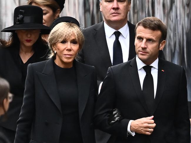 French President Emmanuel Macron (right) and his wife Brigitte Macron. Picture: Marco Bertorello/AFP