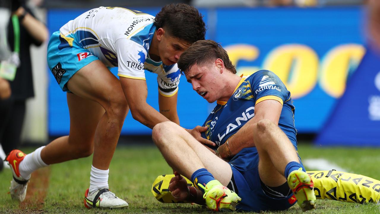 Sean Russell grabs at his ribs after the collision. Picture: Mark Metcalfe/Getty