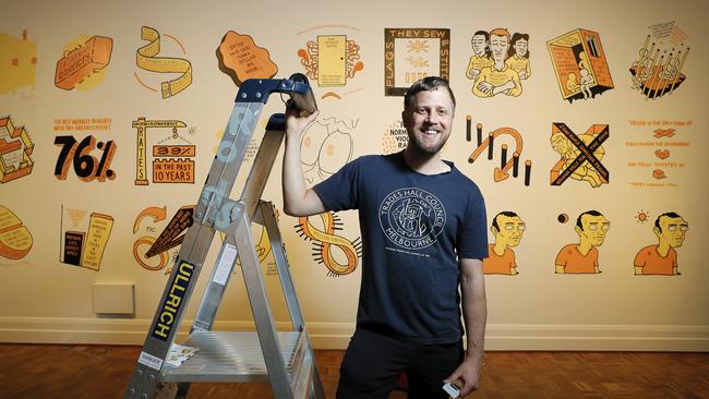 Artist Sam Wallman with one of his pieces in the Tasmanian Museum and Art Gallery’s exhibition A Journey to Freedom. Picture: RICHARD JUPE