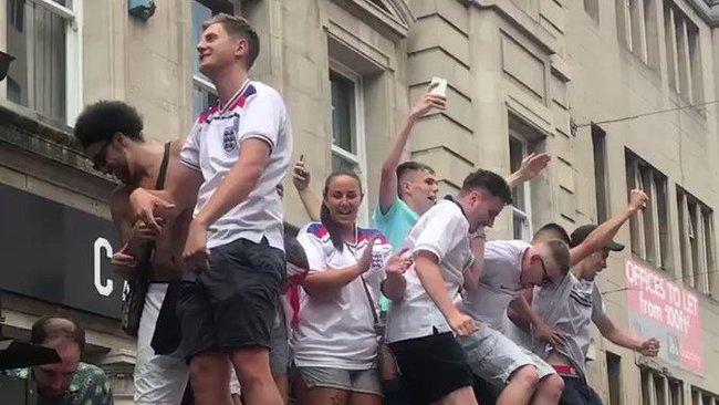 England Fans Dance on Bus Stop Canopy in Nottingham