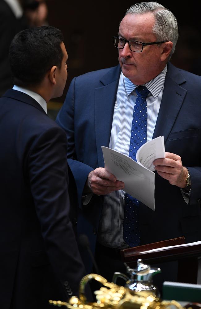 Alex Greenwich (left) talks to Health Minister Brad Hazzard. Right-wing MPs are questioning how involved Mr Hazzard was in bringing the bill to fruition. picture: Joel Carrett