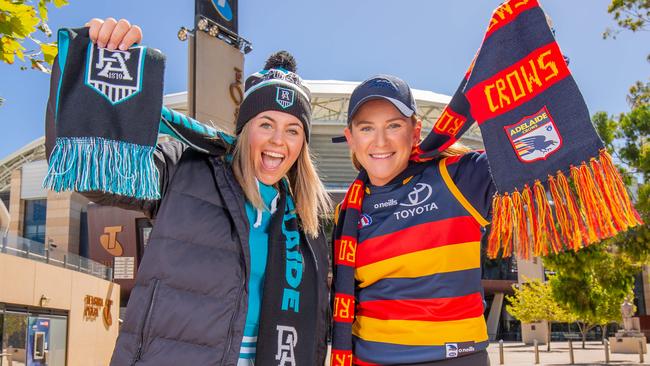 Stephanie Way with Daniela karantonis in Crows and Port Adelaide team march outside the Adelaide Oval CBD. Pictured on March 11th 2023. Picture: Ben Clark